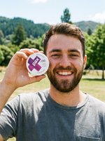 Reviewer holding a PAX Mixed Berries tin (sample)