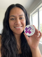 Mele T from Mangere holding a PAX Mixed Berries tin